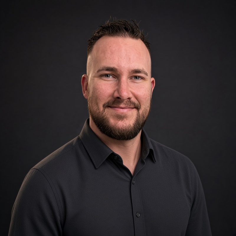 Joe, founder of Lockhold, in a dark shirt against a dark background